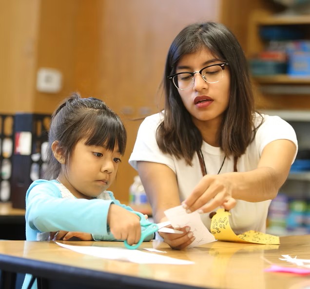 Teacher Helping Student
